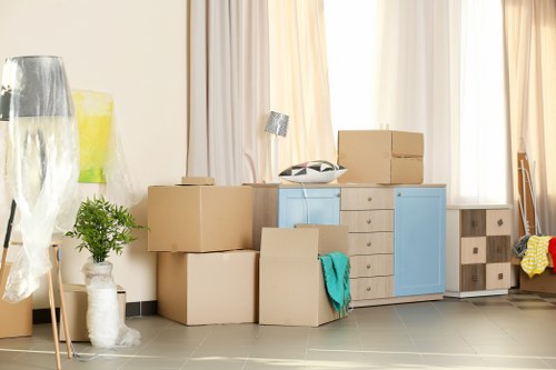 Local home moving service in Hammersmith with packed boxes and moving van