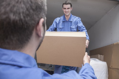 Student removals team moving boxes in Hammersmith street