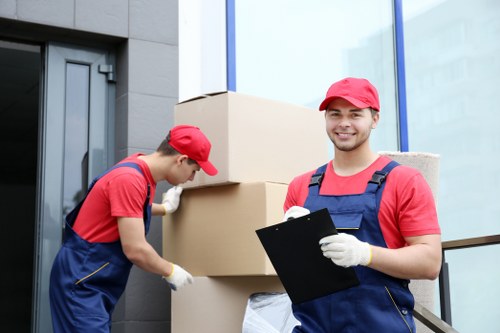 Hammersmith moving team packing and loading household belongings into a removal van