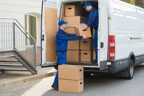 Moving van loading service with boxes and furniture