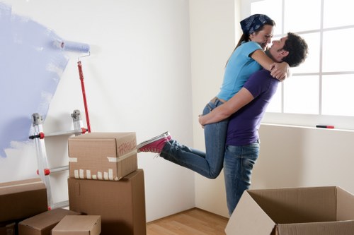 Professional flat removals in Hammersmith with packed boxes and moving equipment