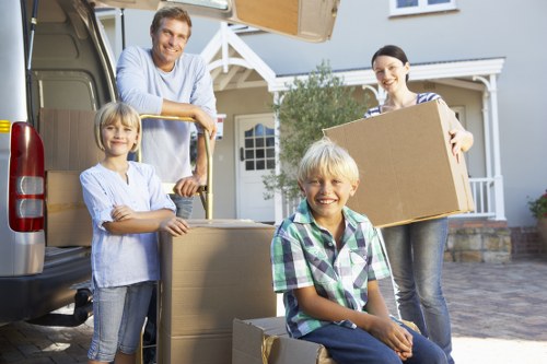 Unpacking boxes in a Hammersmith apartment after relocation