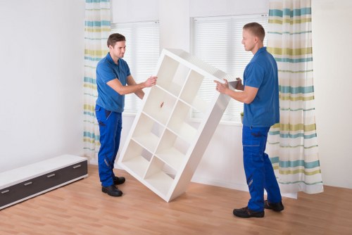 Professional movers handling furniture for house removals in Hammersmith