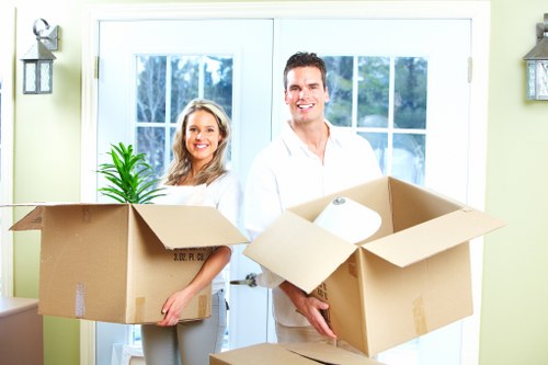 Commercial office moving services in Hammersmith with labelled crates and furniture